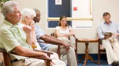 Five people in a waiting room